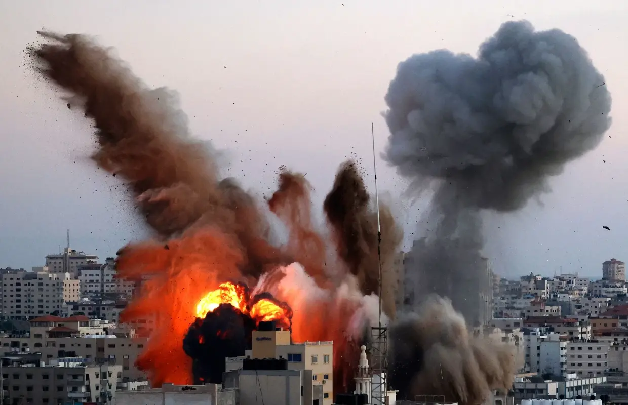 Smoke billows after an Israeli airstrike on Gaza City targeted the Ansar compound, linked to Hamas, in the Gaza Strip on Friday. Mahmud Hams / AFP - Getty Images