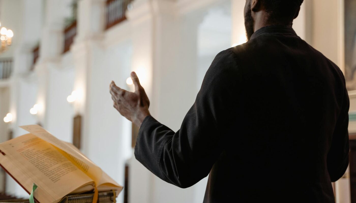a priest in black vestment