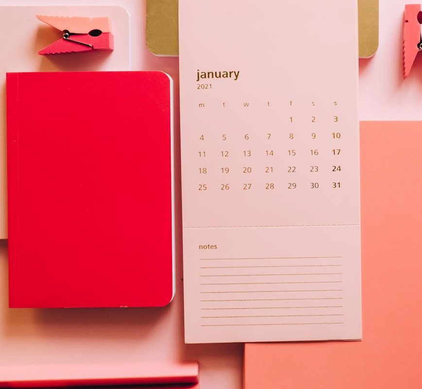 pink and gold stationery in composition