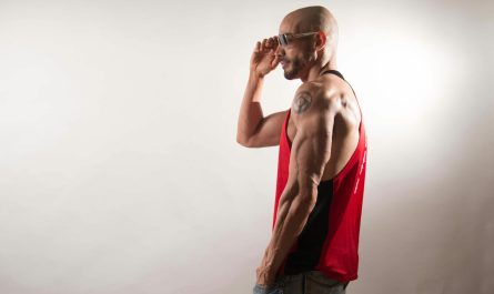 brawny man in sunglasses and red tank